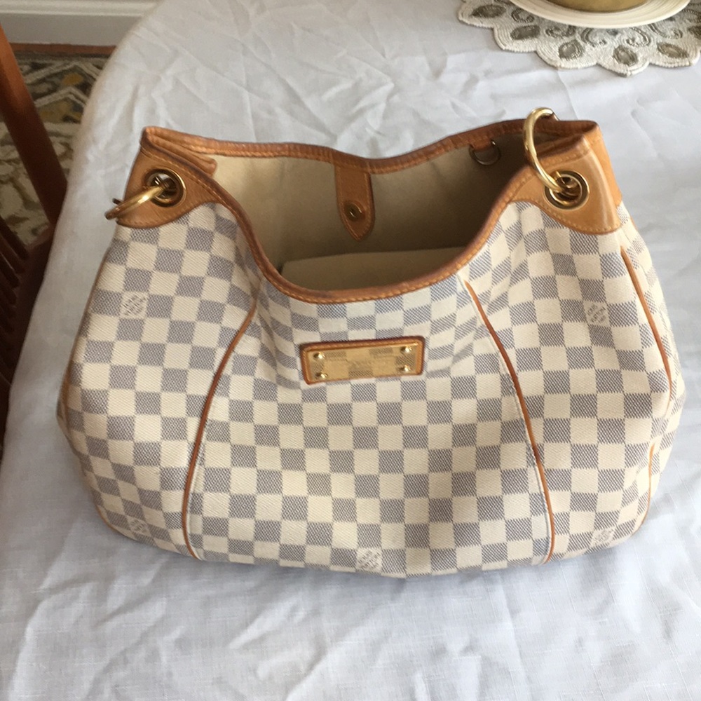 Louis Vuitton’s canvas/authentic pocketbook